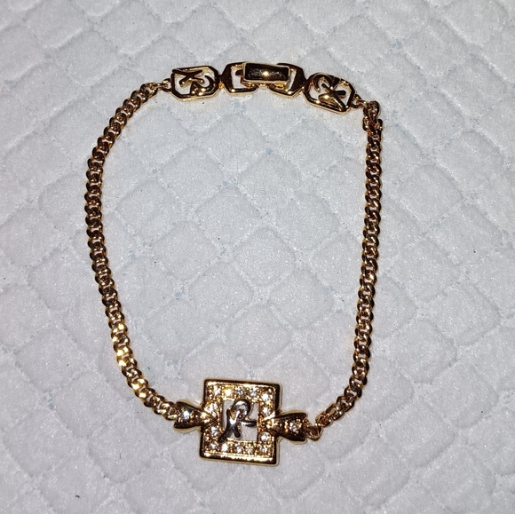 Nina Ricci Jewelry - Nina Ricci Rhinestone Logo Gold Tone Bracelet